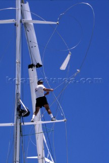 Bowman climbs into rigging and stands on the spreaders of a dismasted maxi yacht