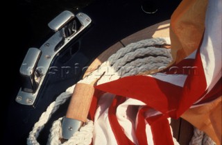 Composition of cleat, rope and flag on aft deck