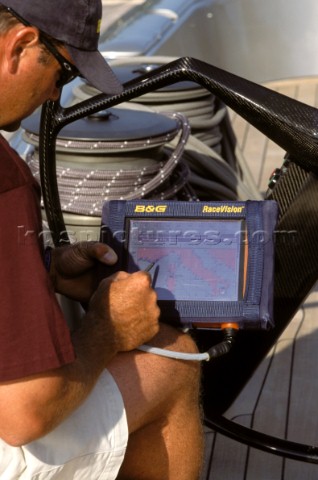 Maxi yacht  Rolex Cup  man using RaceVision unit KosStrategicKPS 56859 Crew member using navigation 