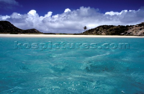 Clear shallow water off deserted beach