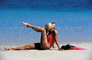 Model strikes a pose on a sandy beach