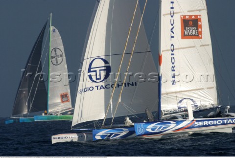 Open 60 Trimaran Sergio Tacchini skippered by Karine Fauconnier and Damian Foxall leads Bayer out to