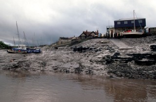 Fishing boats on the mud at low tide on the rive Avon, Bristol, UK