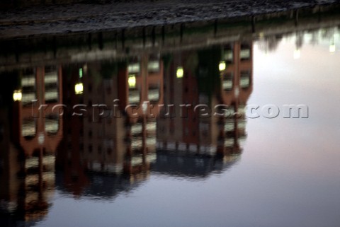 Reflection of buildings on the river Thames London UK