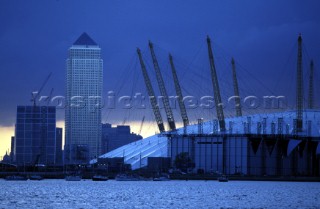 Canary Wharf and the Docklands behind the Millennium Dome on the River Thames, London