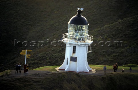 Lighthouse on top of grassy hill New Zealand