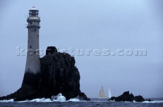 Yachts approach the Fastnet rock in a grey mist