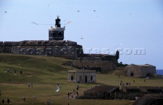 Lighthouse and old fort on hill top in Puerto Rico