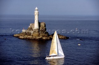 Racing yacht Broomstick rounding the Fastnet lighthouse during the 1995 Fastnet Race