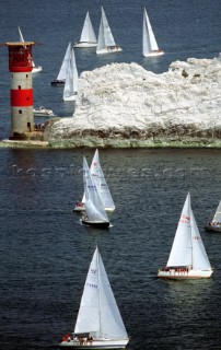 Racing boats sailin round the Needles during the Round the Island Race, Isle of Wight, UK