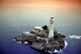 Aerial view of the Fastnet lighthouse in the Irish Sea at sunrise