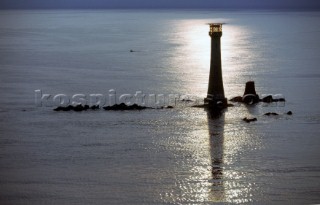 Sun reflected on the sea at Eddystone lighthouse off the coast of Plymouth, Devon, UK