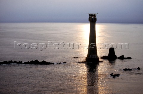 Sun reflections on the sea at Eddystone lighthouse off the coast of Plymouth Devon UK