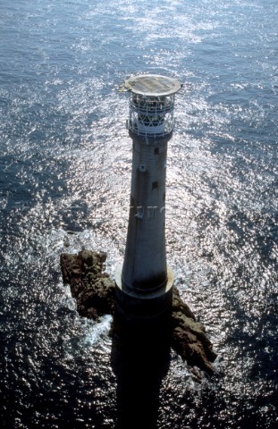 Aerial view of Bishop Rock lighthouse off the coast of Cornwall UK