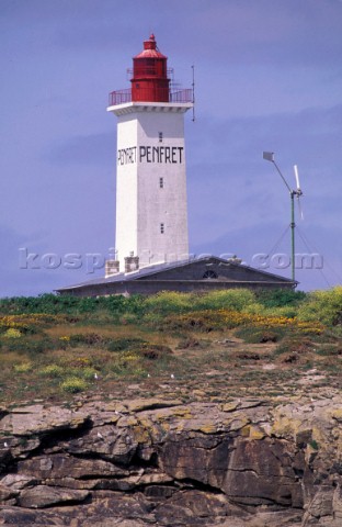 Penfret lighthouse on rocky cliff top Brittany France