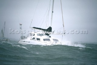 Multihull sailing yacht in rough seas