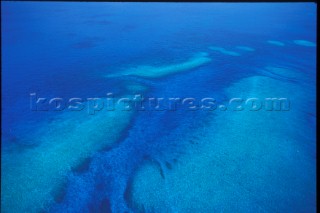 Sea by Coral Reef Patterns - Aerial