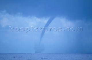 Beginning of a water spout at sea
