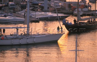 Yachts leave the port of Saint Tropez at dawn