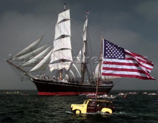 The Star of India out for a rare sail off San Diego is greeted by canoe clubs and Da Woody wagon with a large Stars and Stripes to show his support to the Star and troops