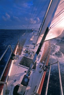 Looking astern from the bow of a large cruising yacht with cutter rig