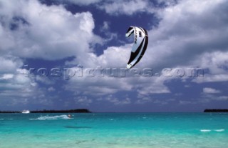 Kite surfers cruising in paradise