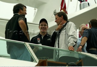 Prince Albert of Monaco centre, talks to Team New Zealand CEO Ross Blackman right and chief executive Toyota New Zealand Bob Field before race four of the Americas Cup in Auckland, New Zealand. Feb, 20. 2002. Racing was abandon due to shift condition on the Harauki Gulf. (Mandatory credit: © Sergio Dionisio/Oceanfashion Pictures)