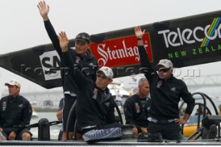 Frenchman Bertrand Pace right, waves at fans with skipper Dean Barker left and Peter Evans center during day four of the Americas Cup in Auckland, New Zealand. Feb, 20. 2002.  Pace was brought in to replace Hamish Pepper as tactician after three straight losses to Alinghi. (Mandatory credit: © Sergio Dionisio/Oceanfashion Pictures)