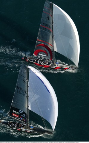Switzerlands Alinghi Challenge head for the finish line along side Team New Zealands NZL82 during ra