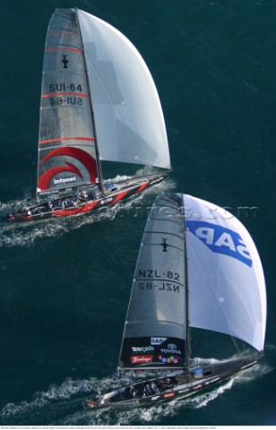 Team New Zealands NZL82 bottom attempts to cover the breeze of Switzerlands Alinghi Challenge during
