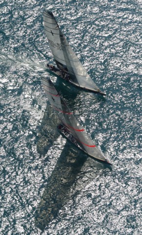 Team New Zealands NZL82  attempts to cover the wind of Switzerlands Alinghi Challenge during race tw
