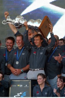 Switzerlands Alinghi Challenge boss Ernesto Bertarelli hold up the Americas Cup during the closing ceremony in Auckland, New Zealand. Mar, 02. 2003.