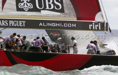 Switzerlands Alinghi Challenge skipper Russell Coutts centre guides SUI64 around the top mark during