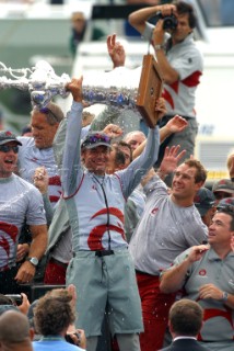 Switzerlands Alinghi Challenge syndicate head Ernesto Bertarelli hold up the Americas Cup after winning race five over Team New Zealands NZL-82 in Auckland, New Zealand. Mar, 02. 2003.  Alinghi lead from the start to win by 0.45 seconds to make history being the first team to ever with the Louis Vuitton Challenge series and the Americas Cup.