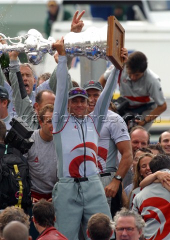 Switzerlands Alinghi Challenge syndicate head Ernesto Bertarelli hold up the Americas Cup after winn