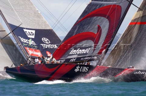 Switzerlands Alinghi Challenge lead Team New Zealands NZL82 during race five to win the Americas Cup