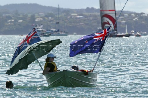 Team New Zealand supports swim and waiting for breeze during race five the Americas Cup in Auckland 