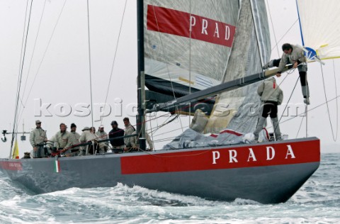Italys Prada Challenge bowman Paolo Bassani right cliams down from the sits spinnaker pole as team m