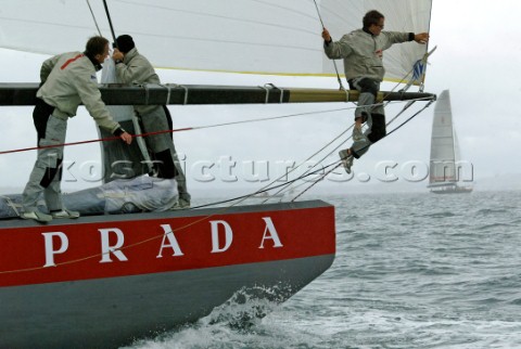 Italys Prada Challenge bowman Paolo Bassani sits on the spinnaker pole in perparation for testing af