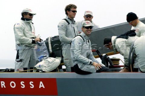 Italys Prada Challenge skipper Francesco de Angelis shears a smile with team mate onboard Luna Rossa