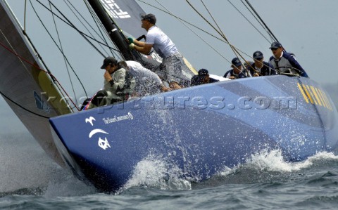 Americas Oneworld Challenge skipper Peter Gilmore right guides USA67 around the top mark during the 