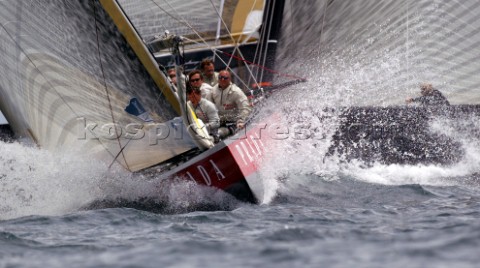 Italys Prada Challenge bow crew perpare to set the spinnaker as Swedens Victory Challenge cross behi