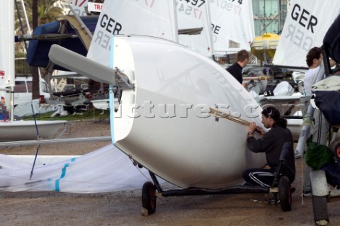 Man fairing the centreboard of a dinghy