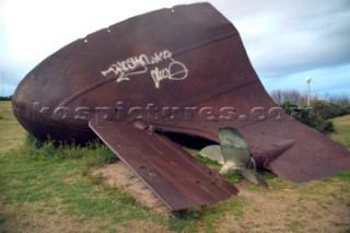 Wreck of ship propellor on beach