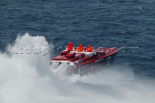 Spray and wash from the stern of an offshore powerboat P1 during the world championship in Malta 2004