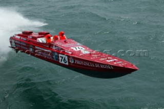 19.06.04, Fumincino, Rome . Local boat Thuraya flys round the course in rough conditions to take line honours for the Evolution class.