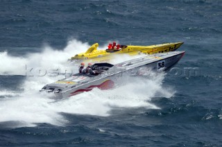 19.06.04. Fiumicino, Rome: New  boat Lonsdale driven by Ranucci, tried out its passes against the Evolution class boat Bianchi Dino in rough conditions off the coats of Italy