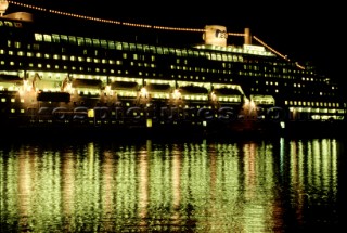 Reflections of lights on cruise ship on water