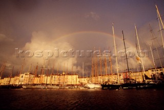 Rainbow over yachts in a harbour