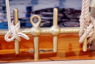 Brass belaying pins on classic yacht Lady Jane